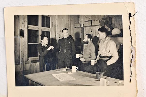 The late RAF veteran Jack Lyon with fellow prisoners of war in a hut at Stalag Luft III.