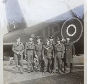 Stan with full crew in front of his Stirling bomber, 90 Squadron RAF Ridgewell.