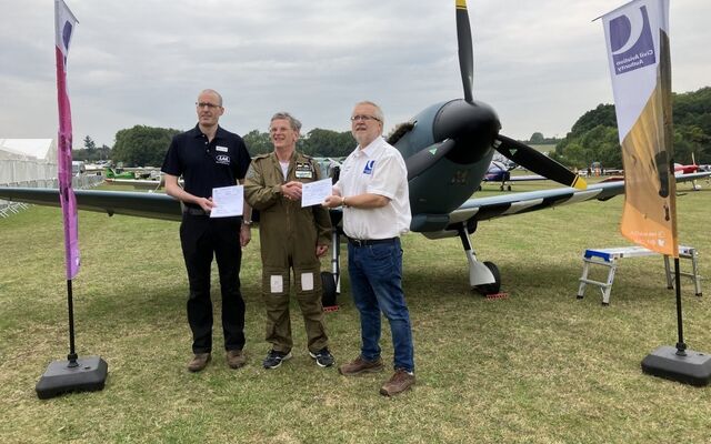Steve Markham being presented with a permit to fly