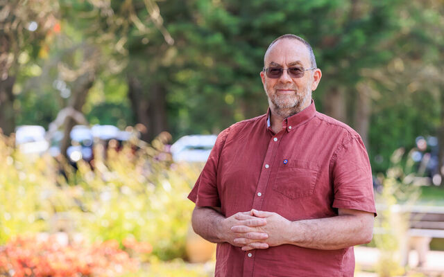 Neil Green standing smiling