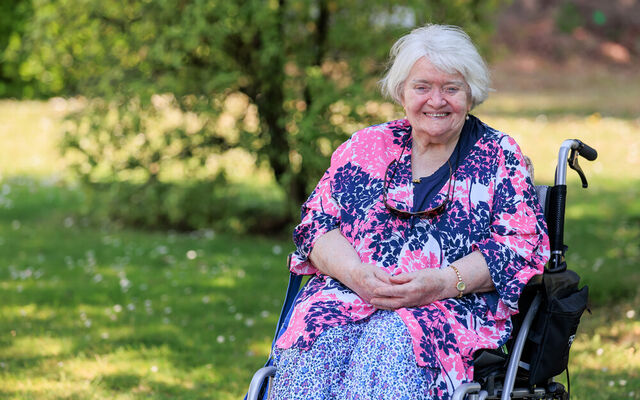 Alice in wheelchair smiling