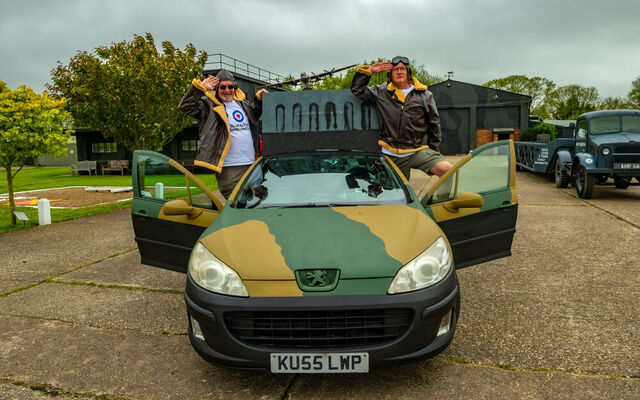 Clive and Ewan saluting alongside transformed Peugeot car for Wacky Rally