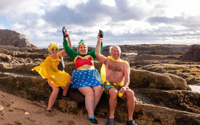 Veronica Young dressed as wonder woman with friends 