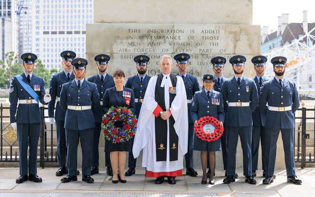 Chaplain, Air Vice-Marshal and King's Colour Squadron in front of memorial
