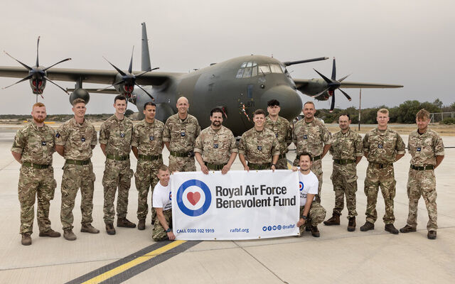 Troops in front of Hercules plane