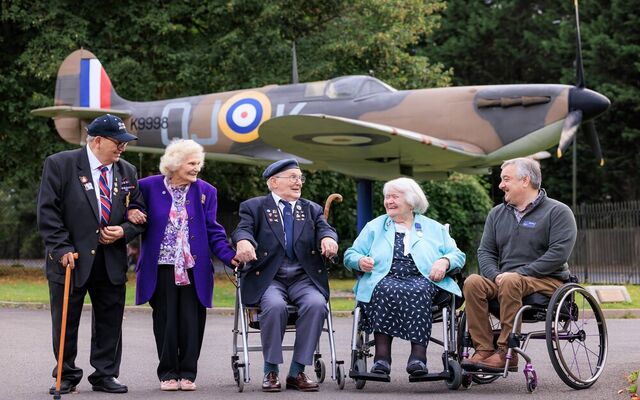 Veterans gather in front of Spitfire display at Biggin Hill