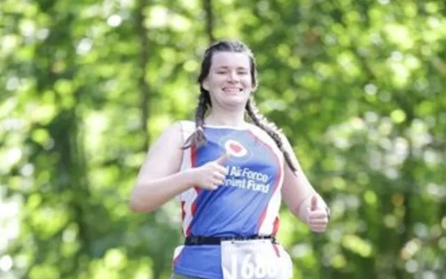 Elizabeth running and smiling in Fund branding
