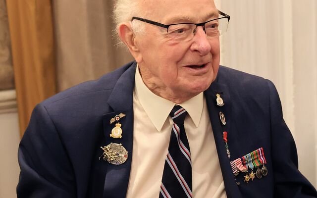 Rusty Waughman in suit with medals 