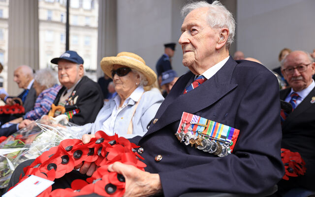 John Bell at Bomber Command Memorial 2022 holding poppy wreath