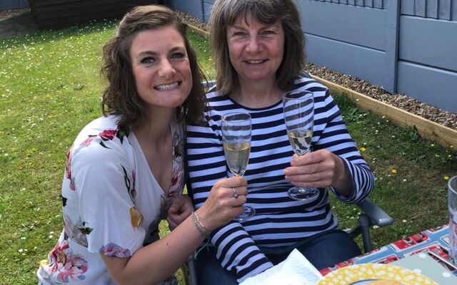 Rosie and Dawn smiling over afternoon tea