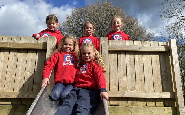5 children in Ben Club hoody at top of slide