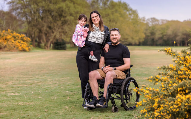 Pic of Neil with wife and daughter in the middle of a field