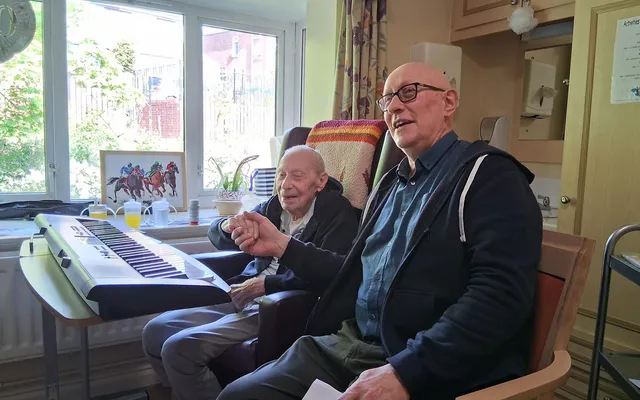 Doug Felgate with Paul learning piano