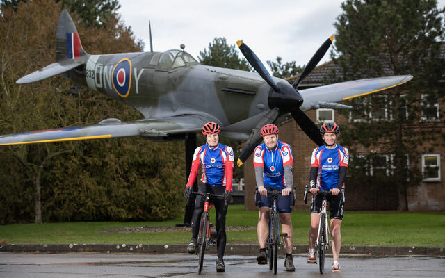 Cyclists in front of plane