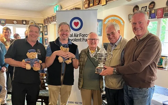 Carpenters Team holding their Winner's cup at the Inter-livery Rifle Shoot
