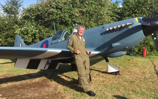 Steve Markham stood in front of his Spitfire replica