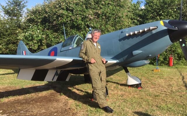 Steve Markham stood in front of his Spitfire replica
