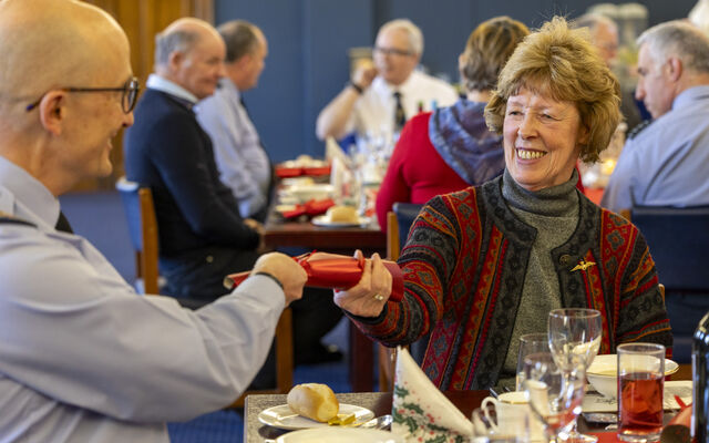 RAF veterans pulling Christmas crackers