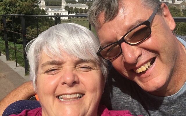 Fund beneficiary Mandy Cole with her husband in a park