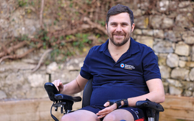 Fund ambassador Rob Bugden smiling in his wheelchair