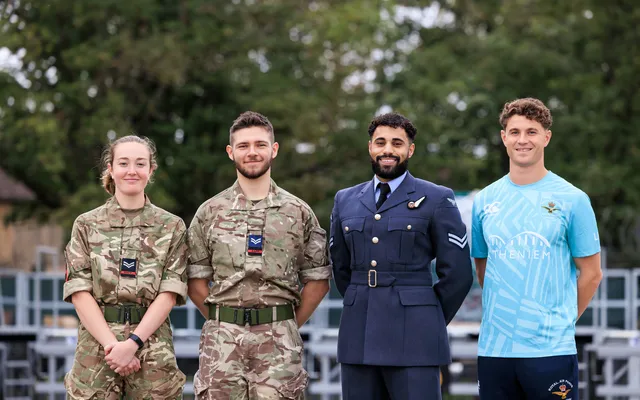 4 personnel in uniform smiling