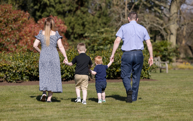 Family walking together on grass