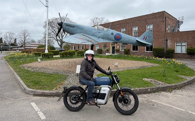 Tony in front of spitfire on his motorbike
