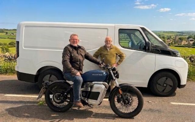 Tony on motorbike and Trevor standing next to him in countryside
