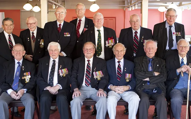 Veterans sat and stood together 