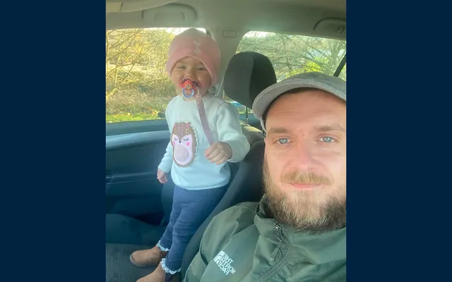 Beneficiary Kieran Head with his daughter