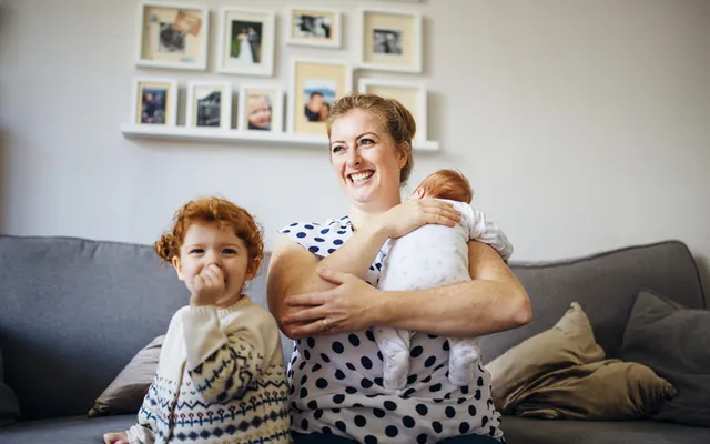 Mum and baby and toddler on sofa