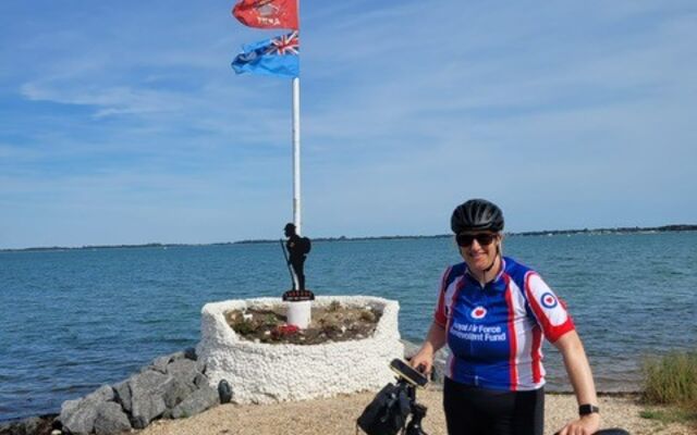 Ashleigh with bike in front of sea
