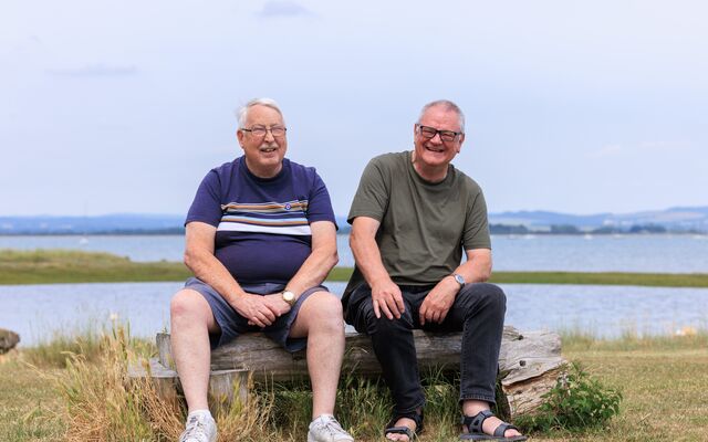 Group Friendship breaks two men sitting together 