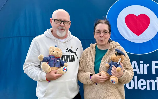 James and Claire holding Fund teddy bears at the Ayr Show