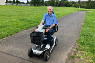 Robert on his mobility scooter in park