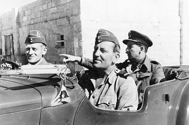 Air Marshal Sir Arthur Coningham, (centre), with Air Vice Marshal Sir Keith Park, (left), and Group Captain Walter Merton during a visit to the island in June 1943. (UK Crown Copyright / MOD. Courtesy of Air Historical Branch, RAF)