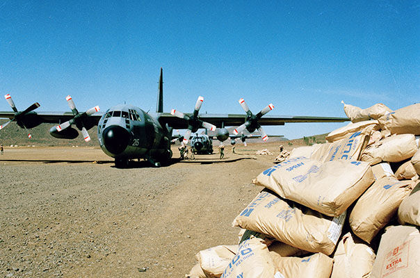 A Hercules C1 from RAF Lyneham lands in Ethiopia to bring famine relief in 1985. Crown Copyright.