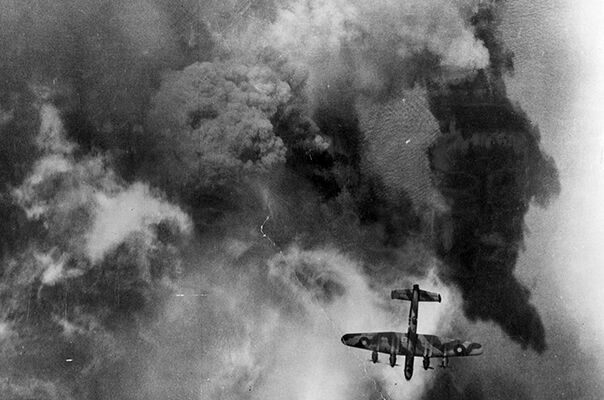 Aerial reconnaissance photograph taken during a daylight raid by 872 aircraft on German defensive positions around Calais, France, on 25 September 1944. Three Handley Page Halifaxes, photographed from an Avro Lancaster, can be seen over the target area.