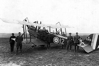Members of 12 Squadron pictured at an airfield on the Western Front with one of the squadron's RE.8 bomber and reconnaissance aircraft, B2260. (Photo: Air Historical Branch)