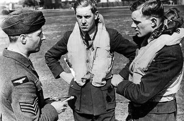 Ground staff talking to pilots during the Battle of Britain.