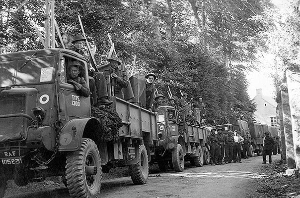 An RAF vehicle convoy pauses in Ver-sur-Mer, Normandy, after landing on 'King' Beach, GOLD Sector before heading inland on the afternoon of 'D-Day', 6 June 1944.