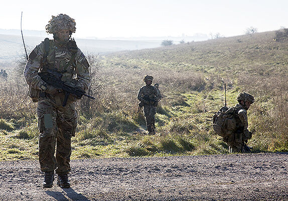 Queen's Colour Squadron on patrol during Live Fire Tactical Training at Salisbury Plain.