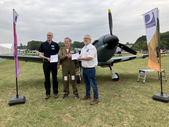 Steve Markham being presented with a permit to fly