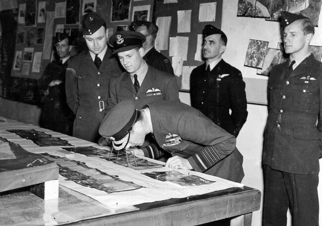 The King and Queen visited 617 Squadron - The Dambusters - at their home station at Scampton on 26 May 1943. During the visit they were intrioduced to the squadron members who carried out the attack and saw images of the subsequent flooding to the Ruhr. Photo dated 27 May 1943. Crown Copyright, MOD.