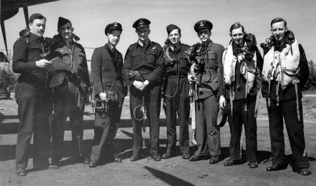 The Australians (left to right): Flight Lieutenant RC Hay, Pilot Officer CL Howard, Flight Lieutenants DJ Shannon and JF Leggo, Pilot Officer FM Spafford, Flight Lieutenant HB Martin, Pilot Officer LG Knight and Sgt RGT Kellow. Crown Copyright, MOD.