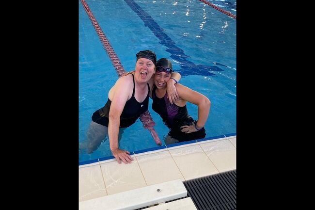 Ann Hughes and Stacey Mitchell smiling in pool