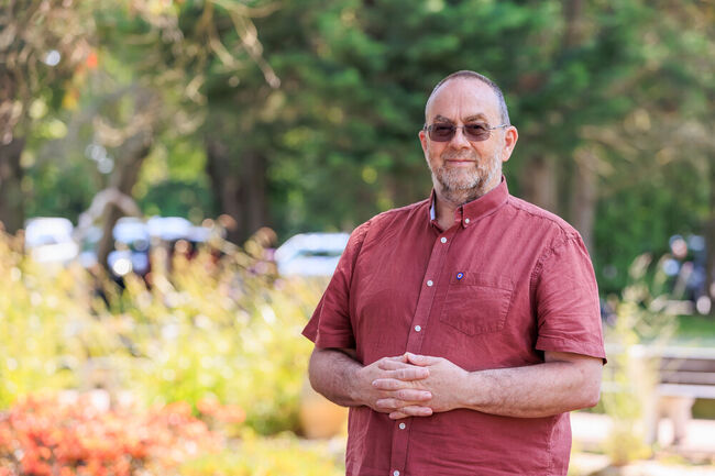 Neil Green standing smiling