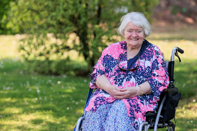 Alice in wheelchair smiling