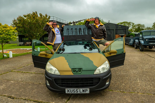 Clive and Ewan saluting alongside transformed Peugeot car for Wacky Rally