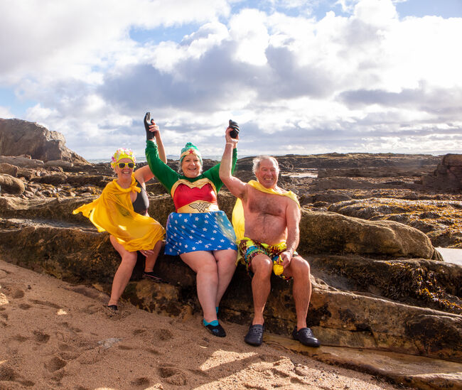 Veronica Young dressed as wonder woman with friends 